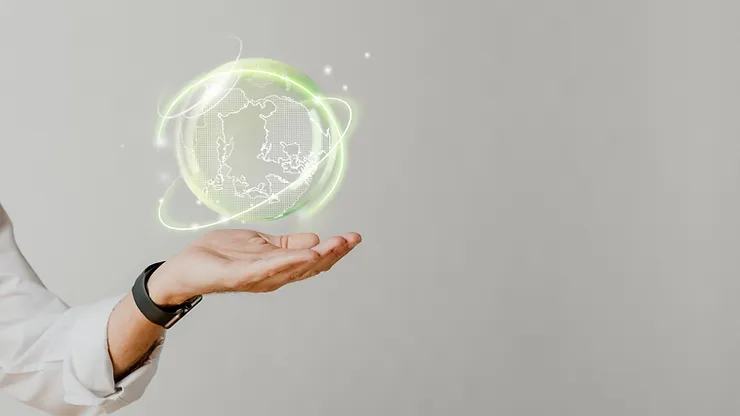 A hand extended with a glowing digital globe hovering above it, representing advanced technology and global communication.